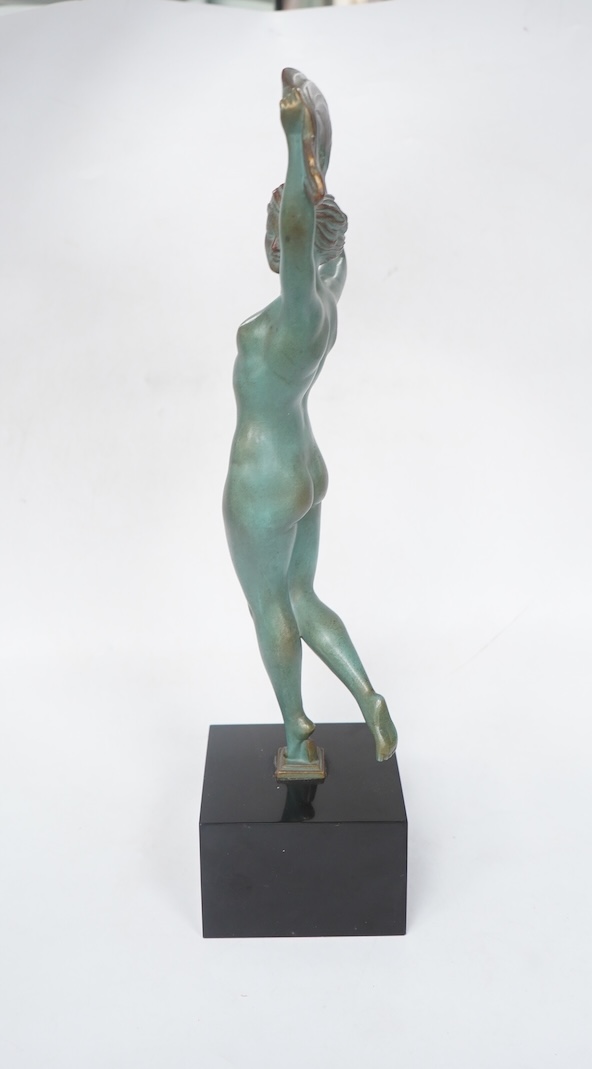 A French Art Deco bronze model of a dancer, green patination, on black marble base. 33cm high. Condition - minor chip to base